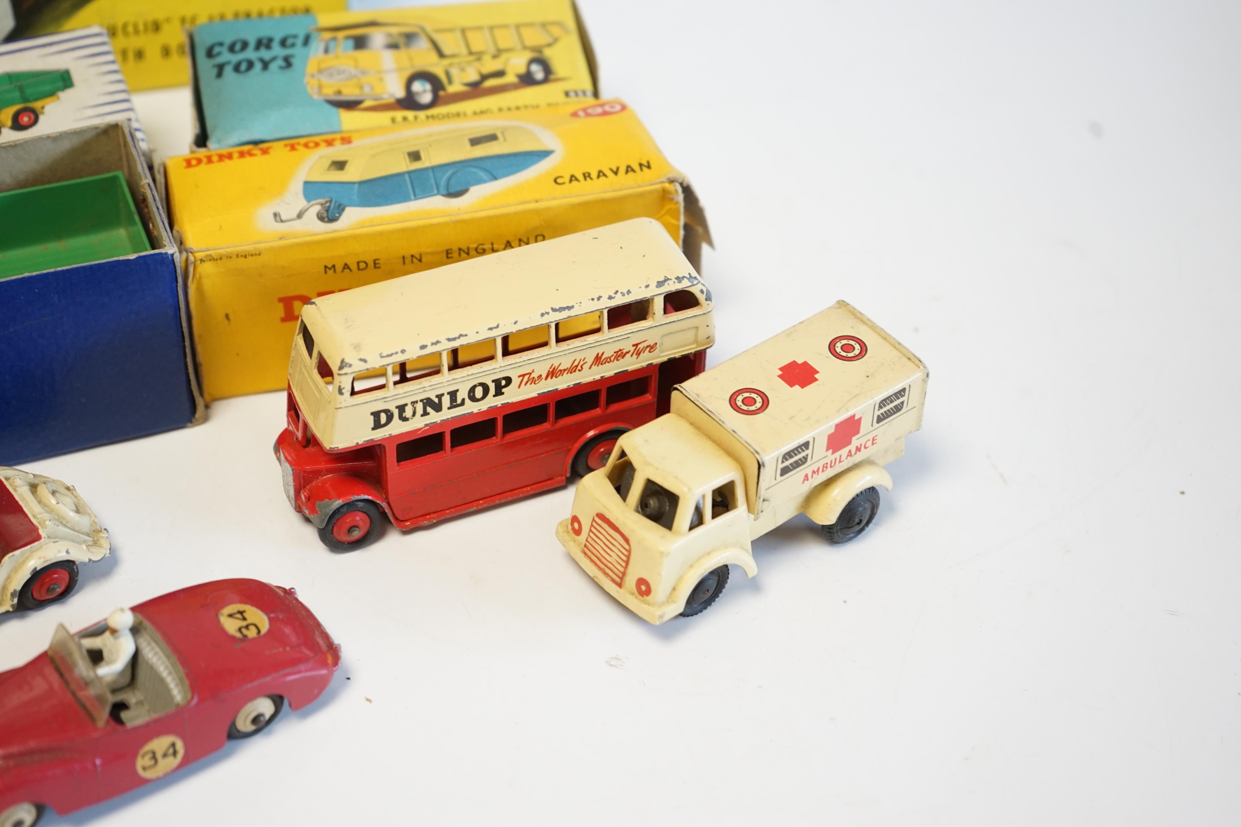 Seven diecast vehicles by Dinky Toys and Corgi Toys including; a Leyland Octopus Wagon (934), a Caravan (190), a Sunbeam Alpine, an MG Midget, a Double Decker bus, a Euclid TC-12 Tractor (1102), an ERF Model 64G Earth Du